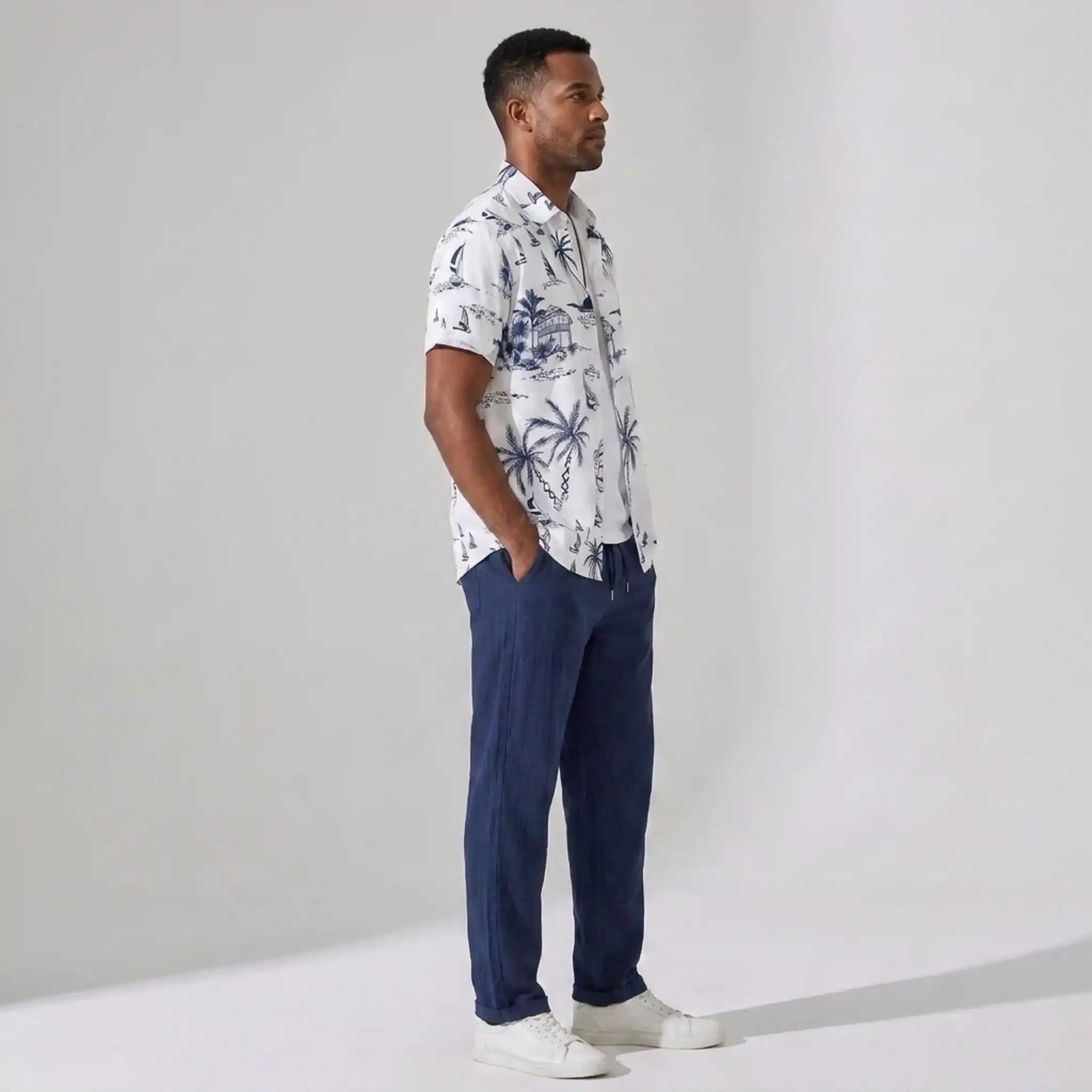 Model wearing island print shirt and straight leg pants set in white – TARLANO
