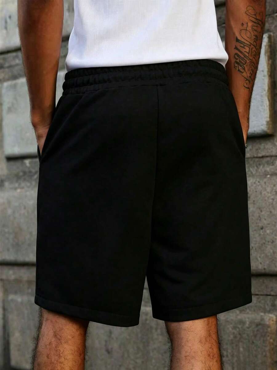 Model wearing knit drawstring casual short in black – TARLANO