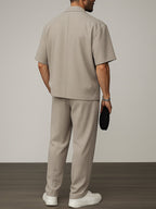 Model wearing khaki short sleeve blazer and trouser two-piece set – TARLANO